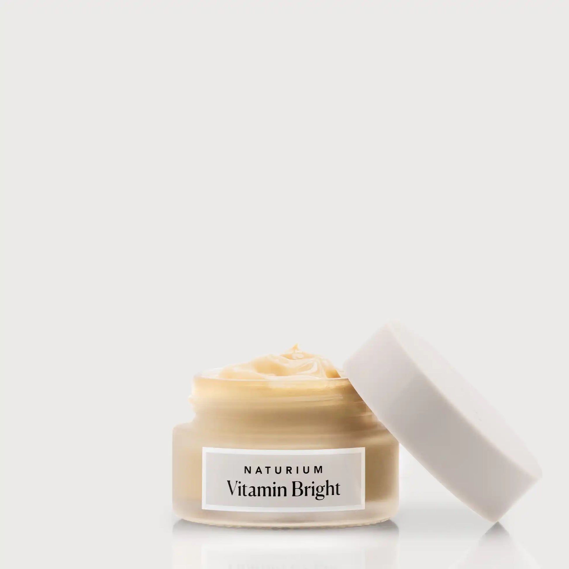 vitamin-bright-illuminating-eye-cream-u1 NATR-VitaminBright_LIGHT_Primary_front_openjar_bone.webp